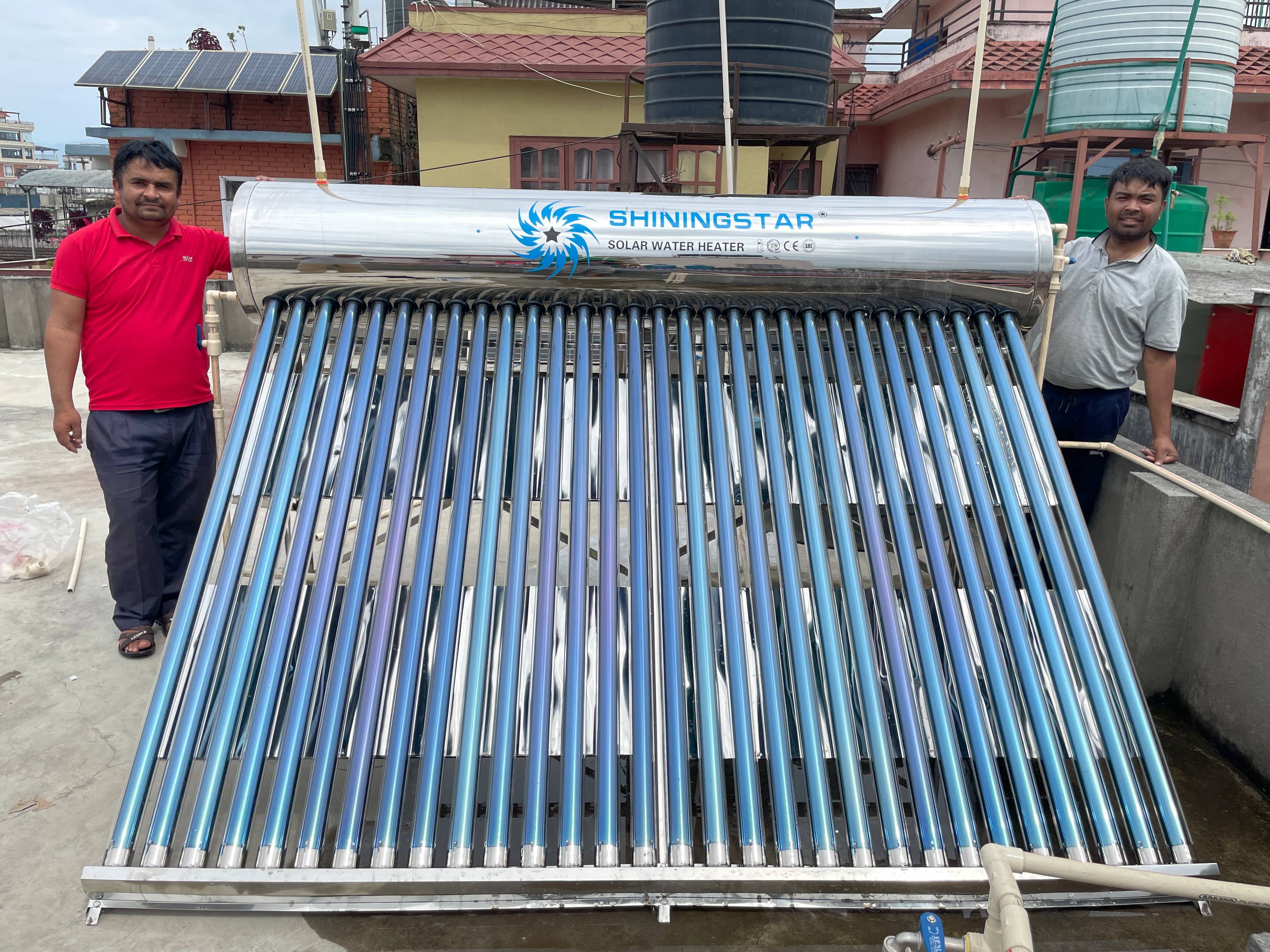 A sleek solar water heater on a rooftop, with flat-plate collectors angled towards the sun.